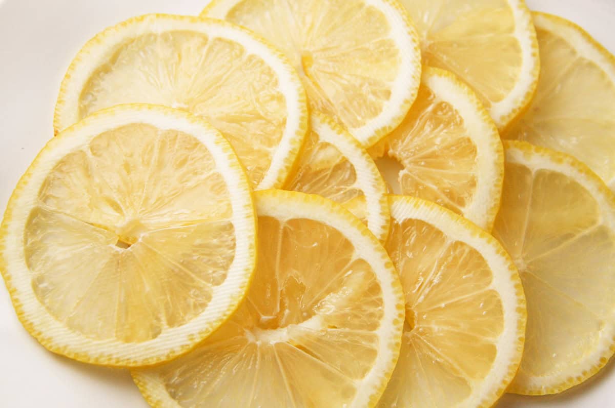 Fresh lemon slices perfect for candied lemon recipes and garnishes.
