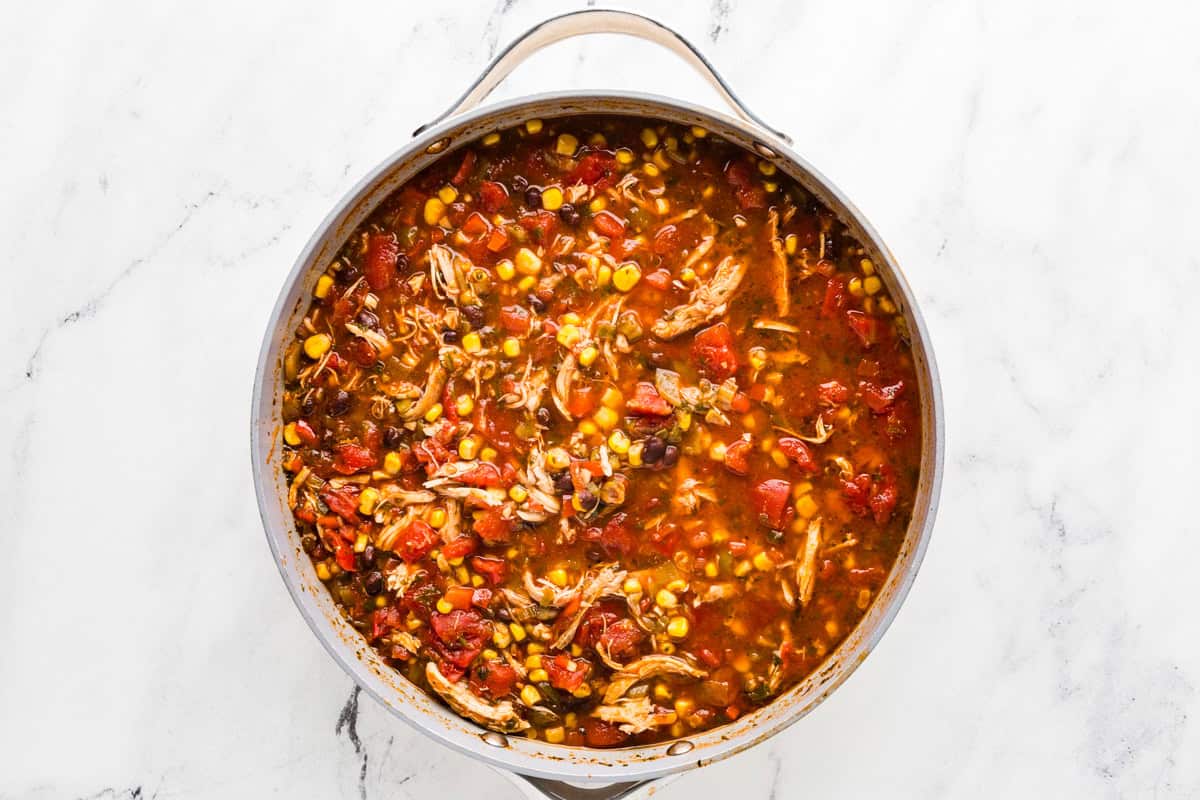 Top view of taco soup cooking in a pan.