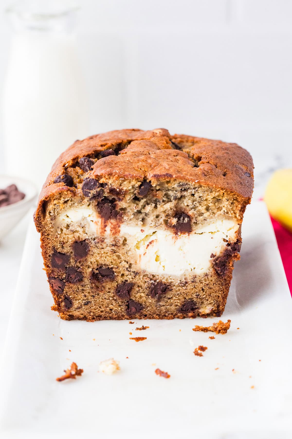 Looking into the center of a loaf of bread with cream cheese and chocolate chips.