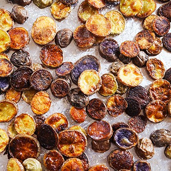 homemade potato chips on a baking sheet