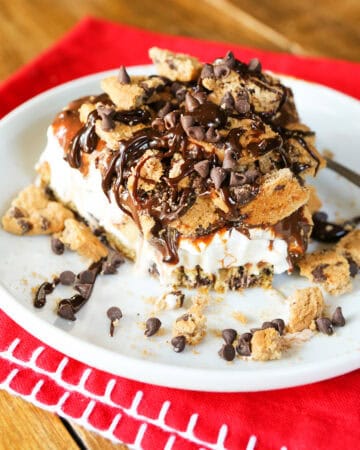 Delicious cookie dough ice cream cake with chocolate chips and drizzle.