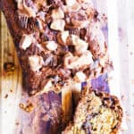 Chocolate peanut butter banana bread with chunks of chocolate and peanut butter swirls.