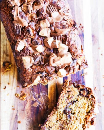 Chocolate peanut butter banana bread with chunks of chocolate and peanut butter swirls.