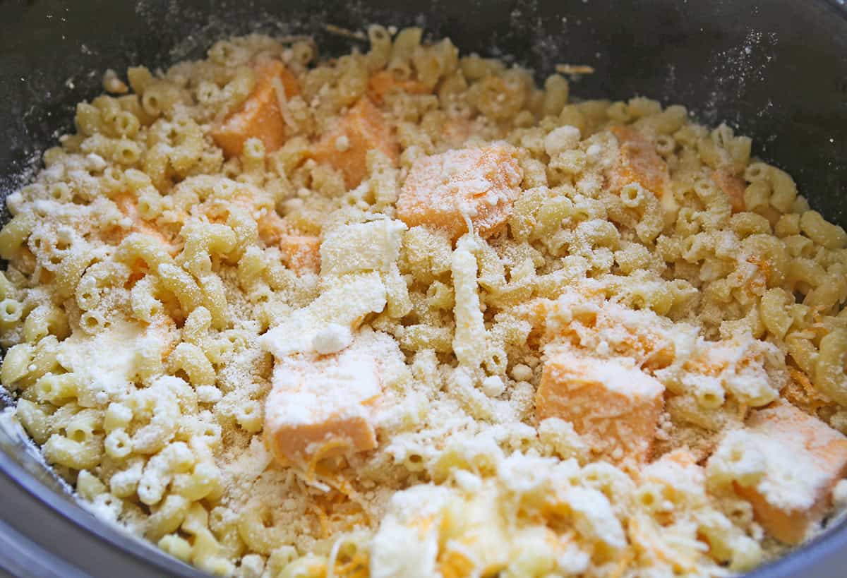 Creamy crock pot mac and cheese with Velveeta cheese and pasta.