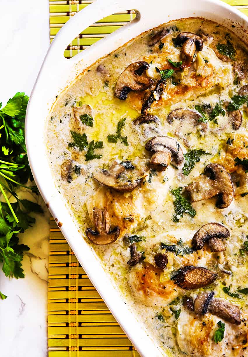 Top view of a pan of creamy chicken and mushrooms baked to perfection.