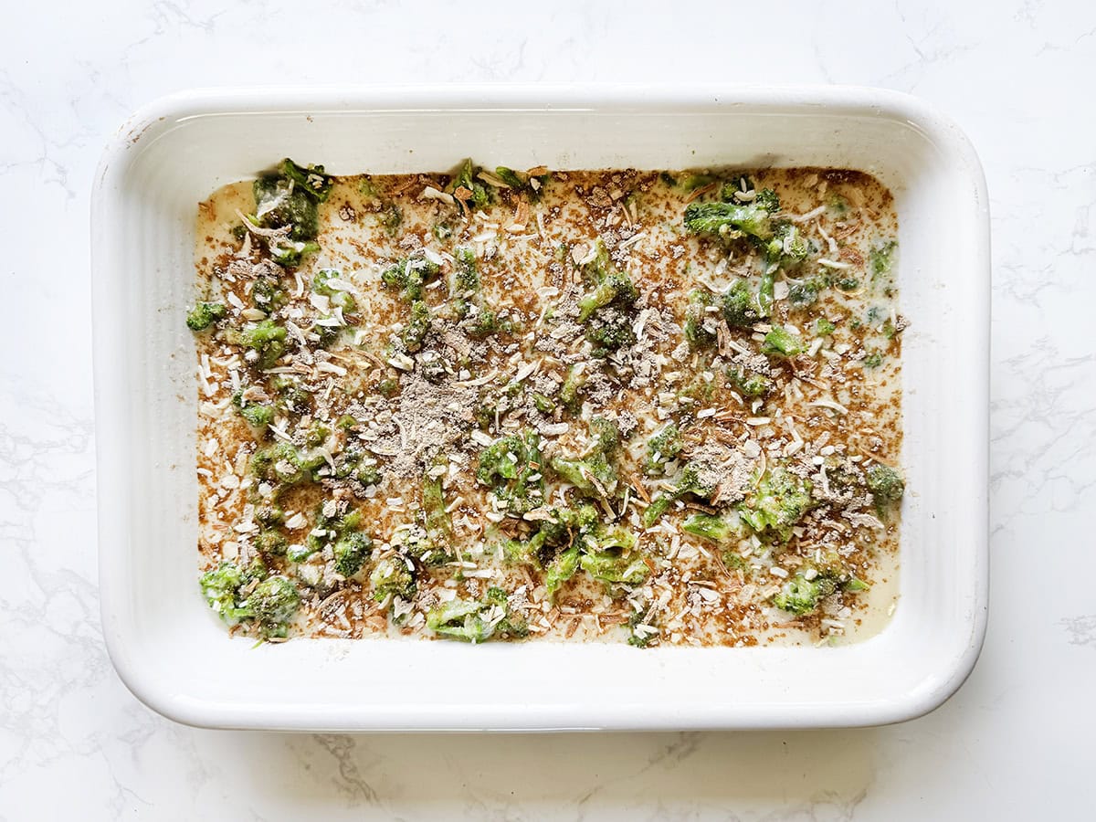 Broccoli, rice, soup, dry soup mix all mixed together in a baking dish before baking.