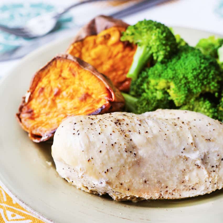instant pot chicken breasts plated with sweet potatoes and broccoli