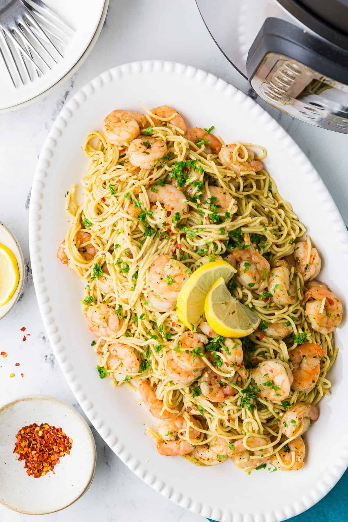 Top view of a serving dish filled with shrimp pasta dish.