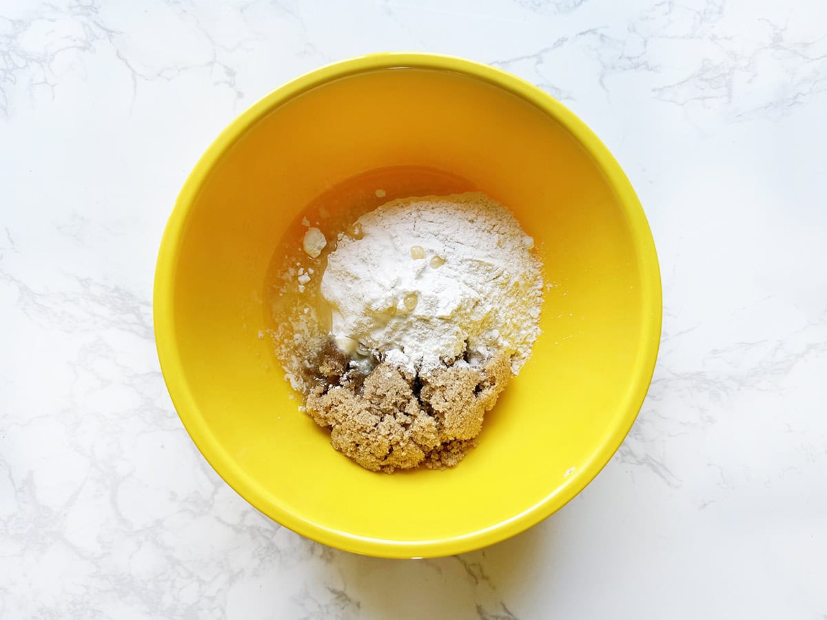 Streusel crumble mixture in a yellow bowl.