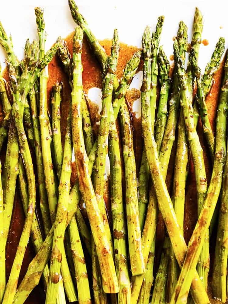 Baked asparagus with balsamic vinegar drizzled over it. 