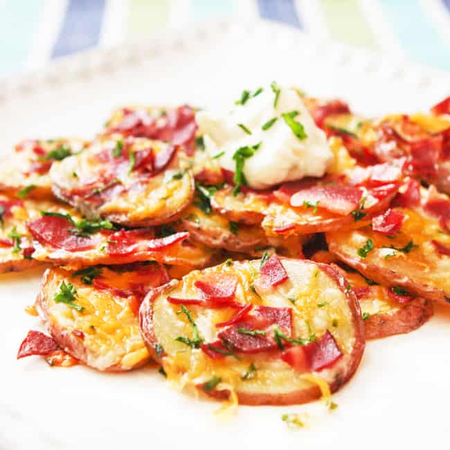 Stacks of loaded baked potato rounds. 