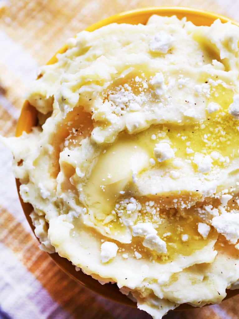 Feta mashed potatoes in a serving bowl.