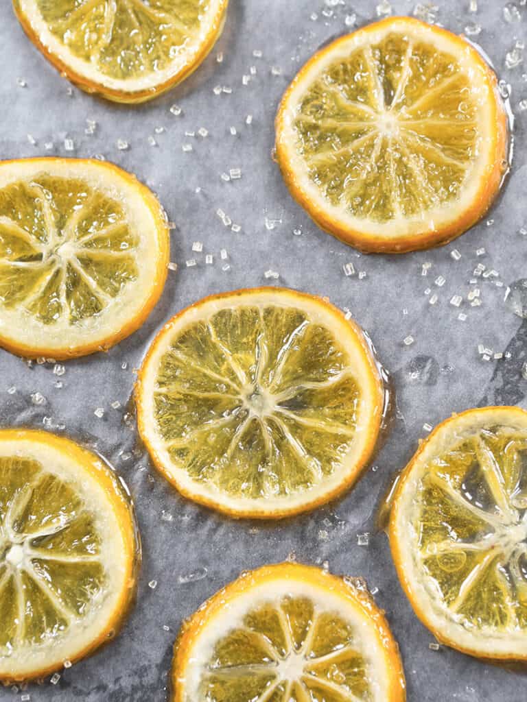 Close up of lemon candied slices with sugar crystals sprinkled over them. 