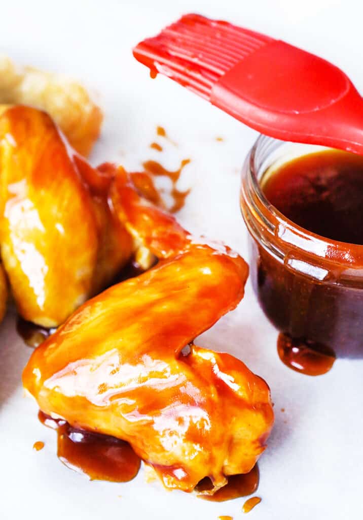 chicken wings with teriyaki sauce spread over tops