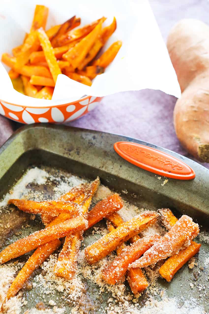 Air fryer sweet potato fries on a baking sheet. 