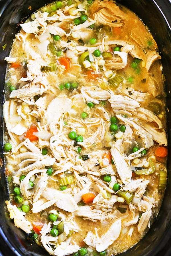 top view of slow cooker filled with chicken pot pie filling