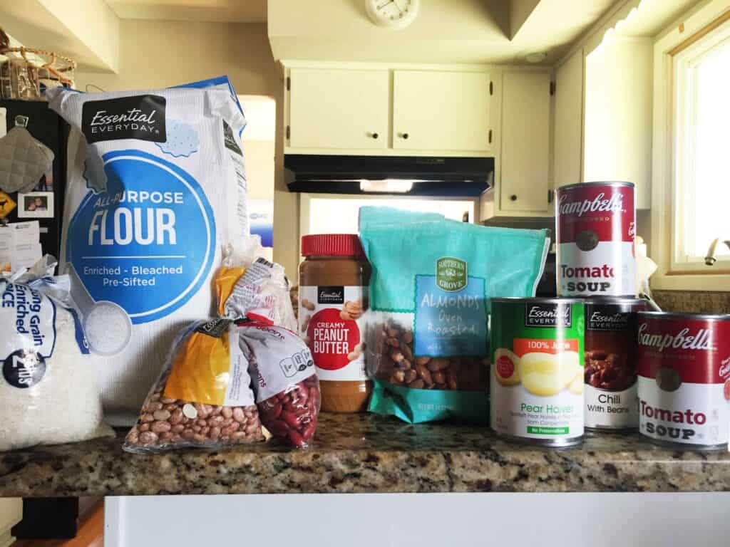 pandemic food lined up: flour, rice, beans, nuts and soup