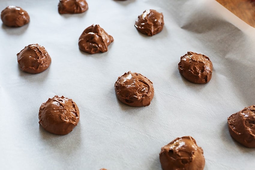 chocolate dough globs on baking sheet ready to bake