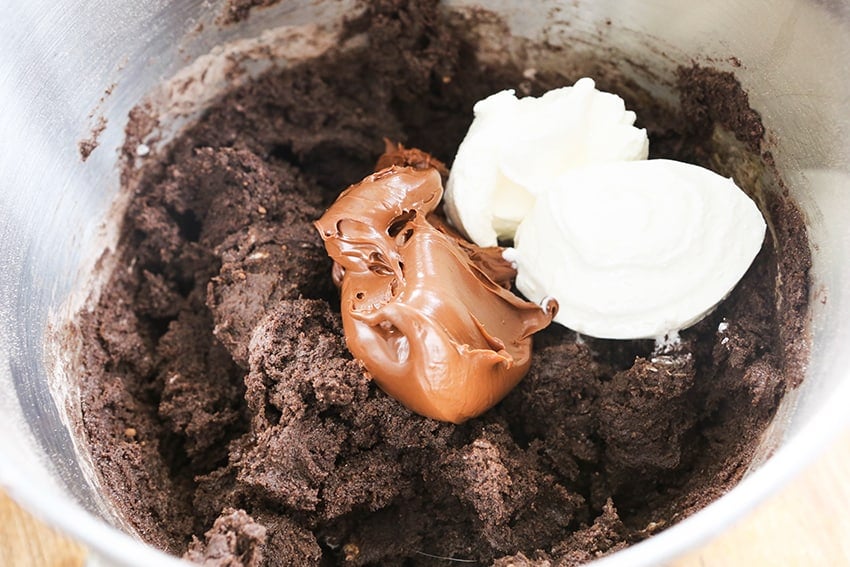 Nutella and sour cream in mixing bowl with cake batter