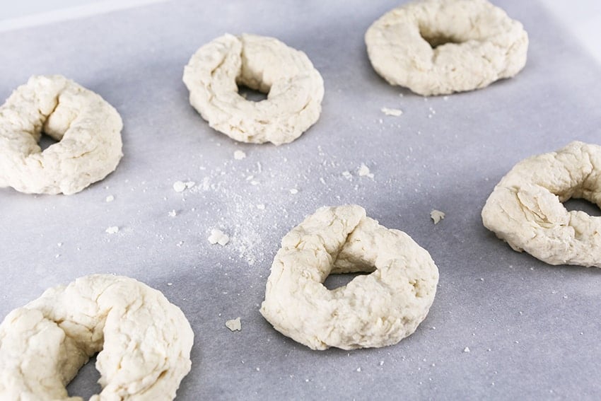 bagel dough on parchment ready to bake