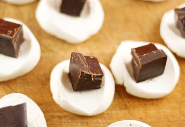 chunks of chocolate sitting inside marshmallows