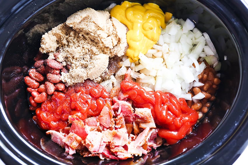 beans, ketchup, onions, mustard and bacon in a crockpot