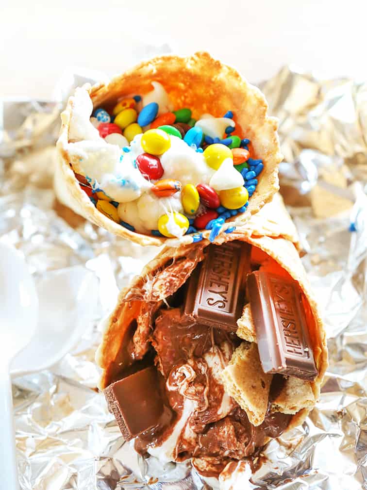 Two waffle cones filled with sugary treats