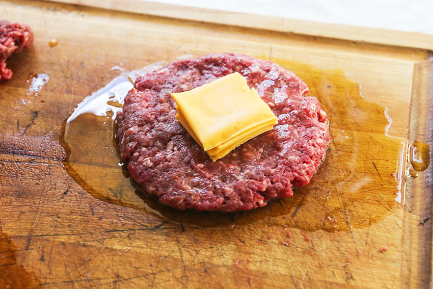 ground beef patty with cheese in the center