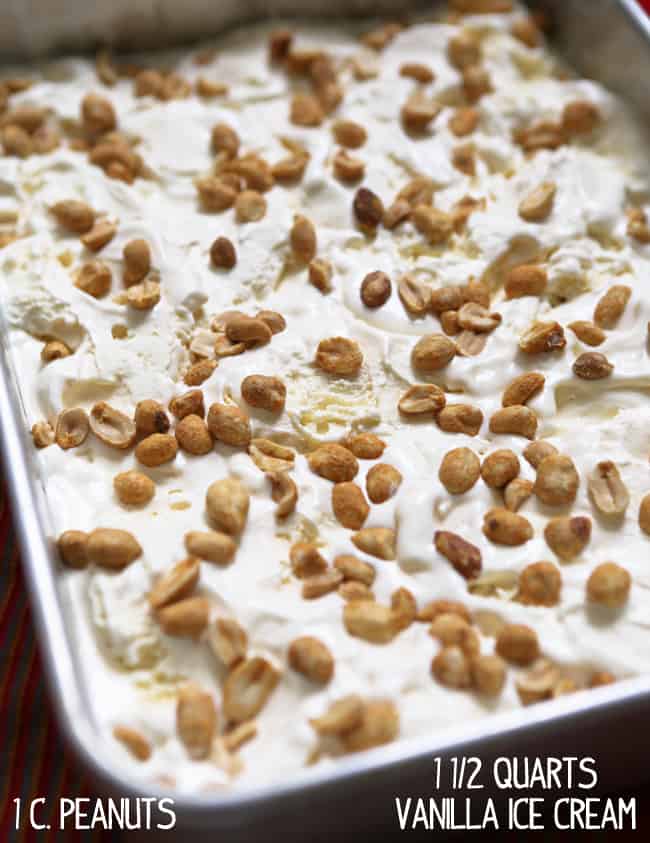 Peanuts on top of ice cream layer in pan