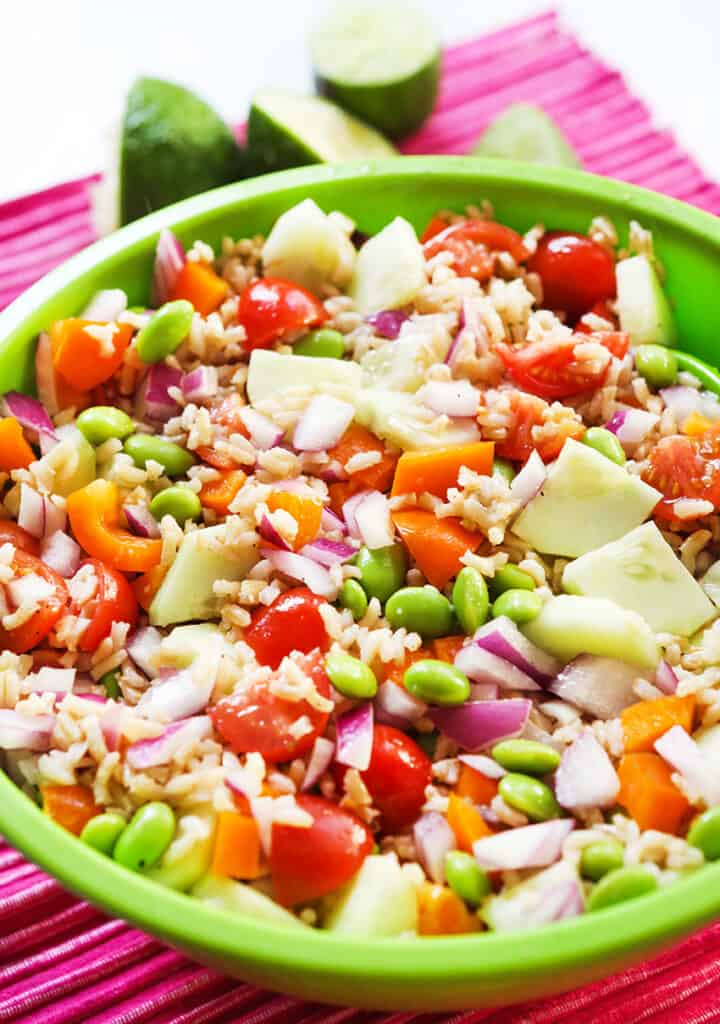 vegetable rice salad in a bowl on a pink placemat