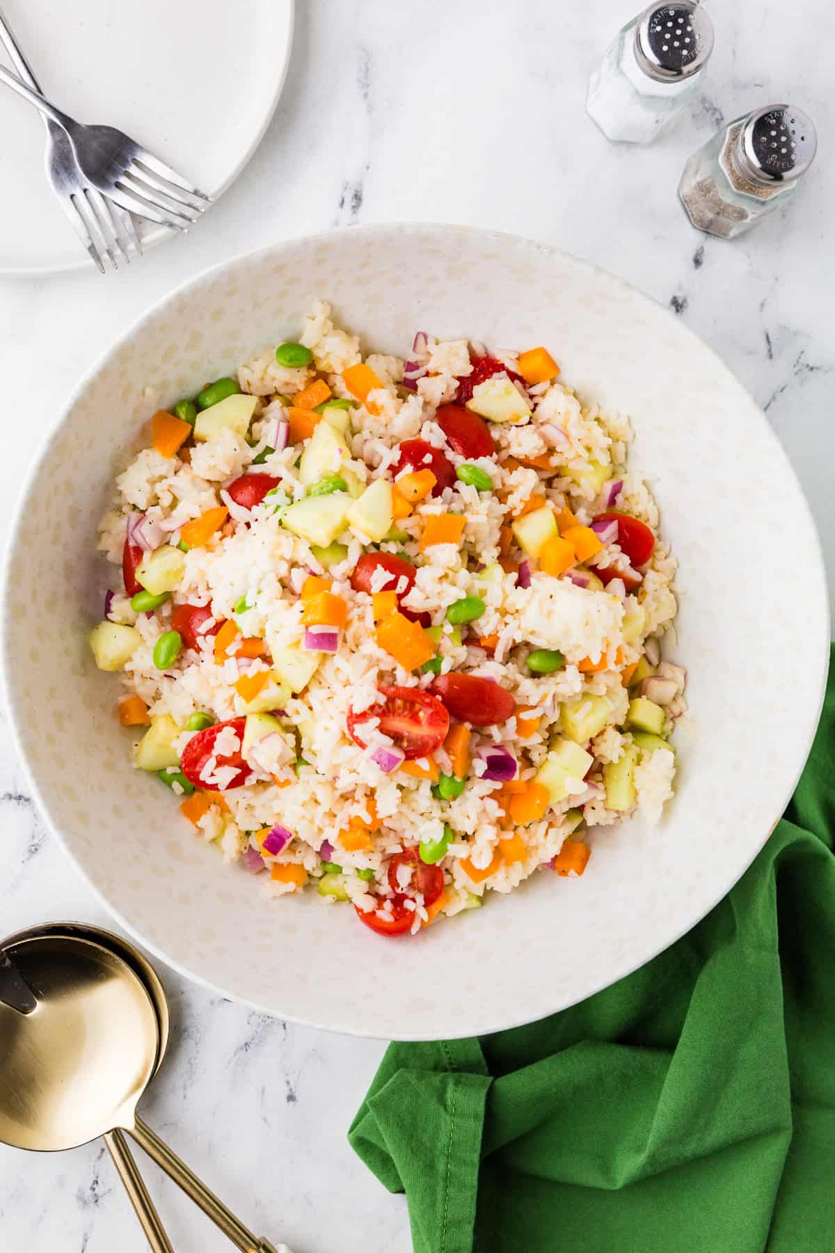 Top view of a serving dish filled with vegetable rice salad.