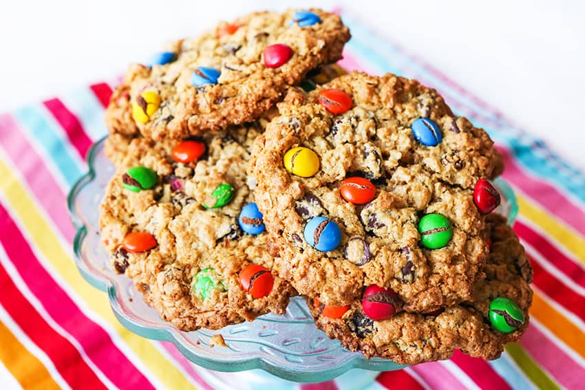 plate of cookies topped heavily with m&m's