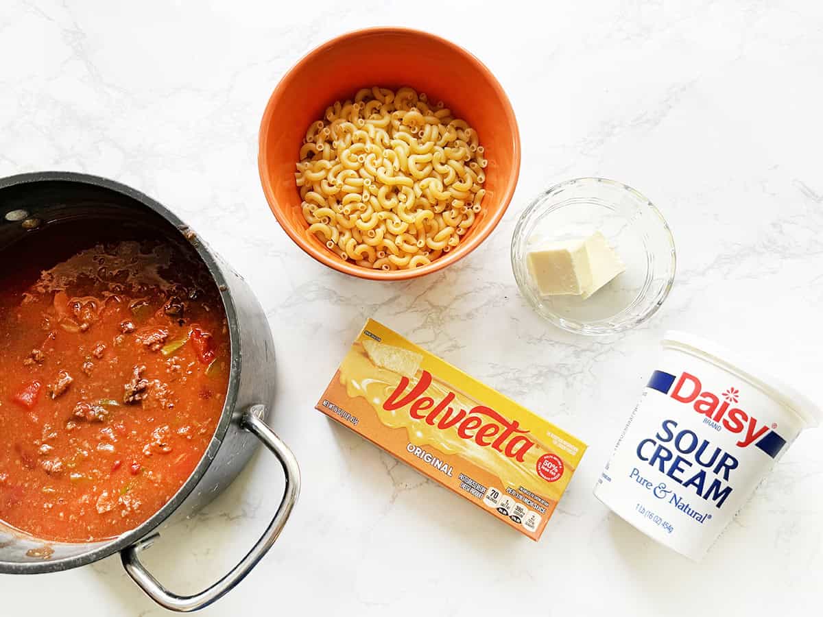 Ingredients for chili mac on a white counter.