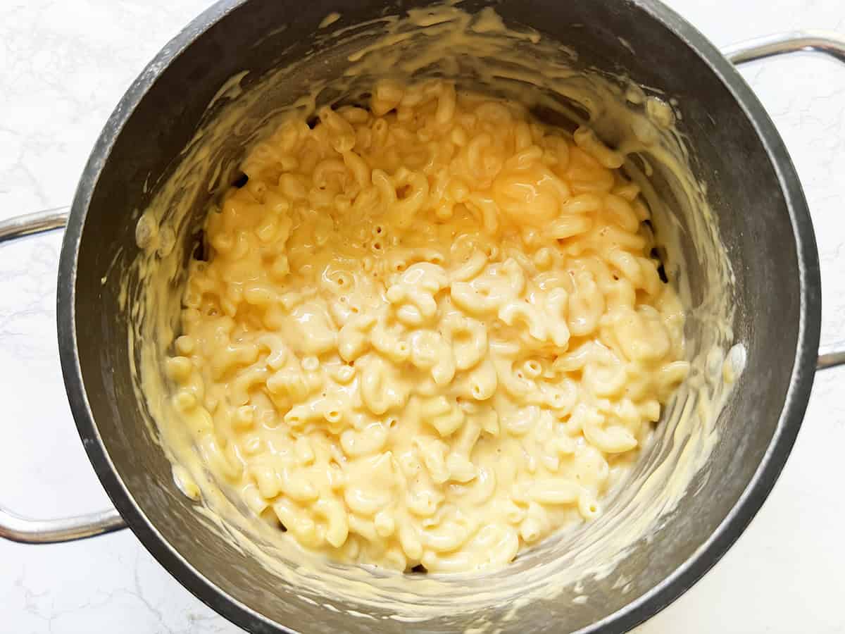 Top view of a creamy batch of mac and cheese in a pan.