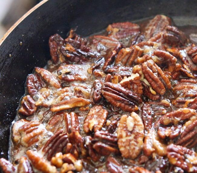 pecans and sugar cooking in a skillet