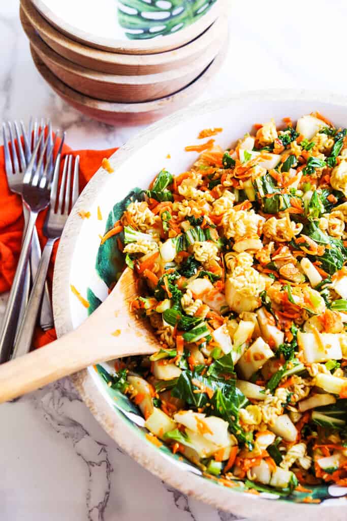 crunchy bok choy salad with a salad tong sticking out