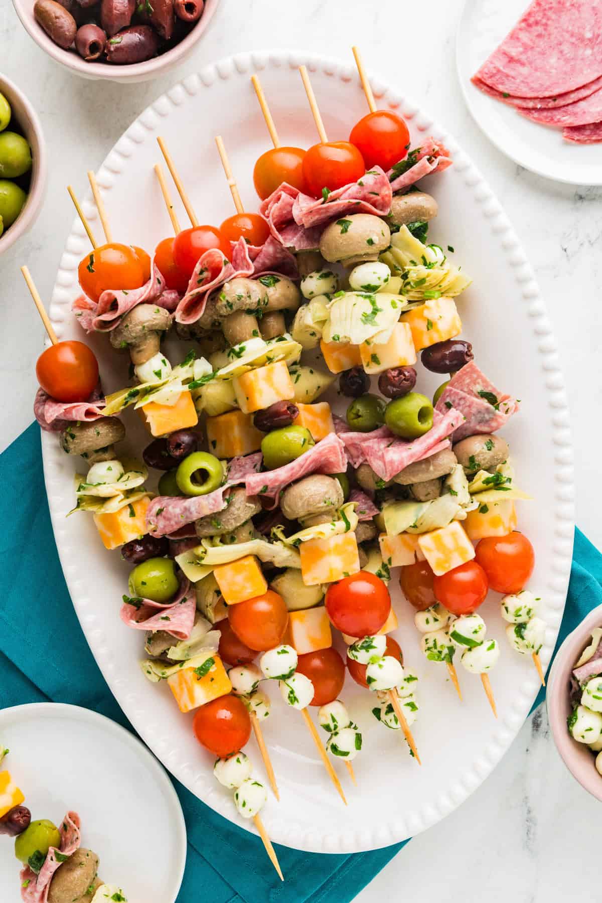 Top view of a serving platter filled with antipasto skewers.