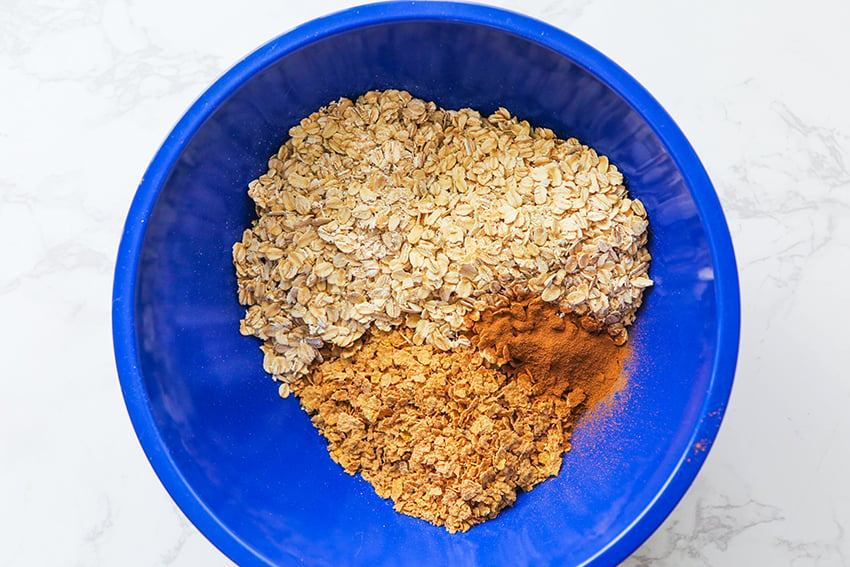 oats, bran flakes and cinnamon in a mixing bowl