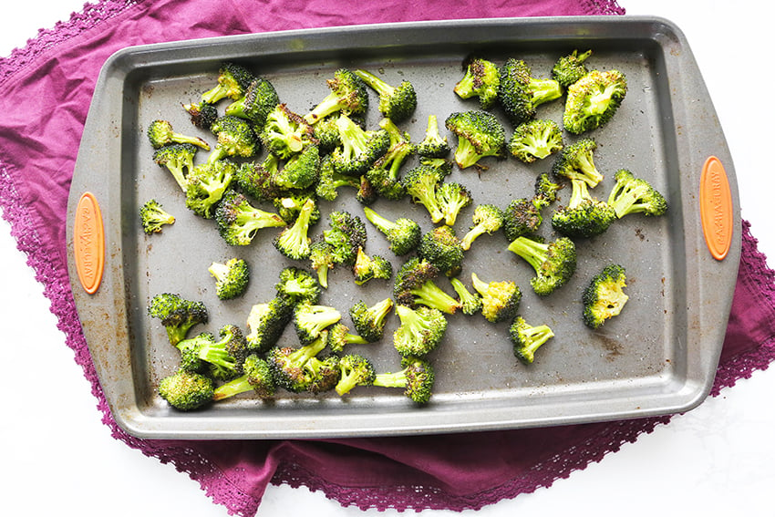 roasted broccoli just out of the oven on a baking sheet