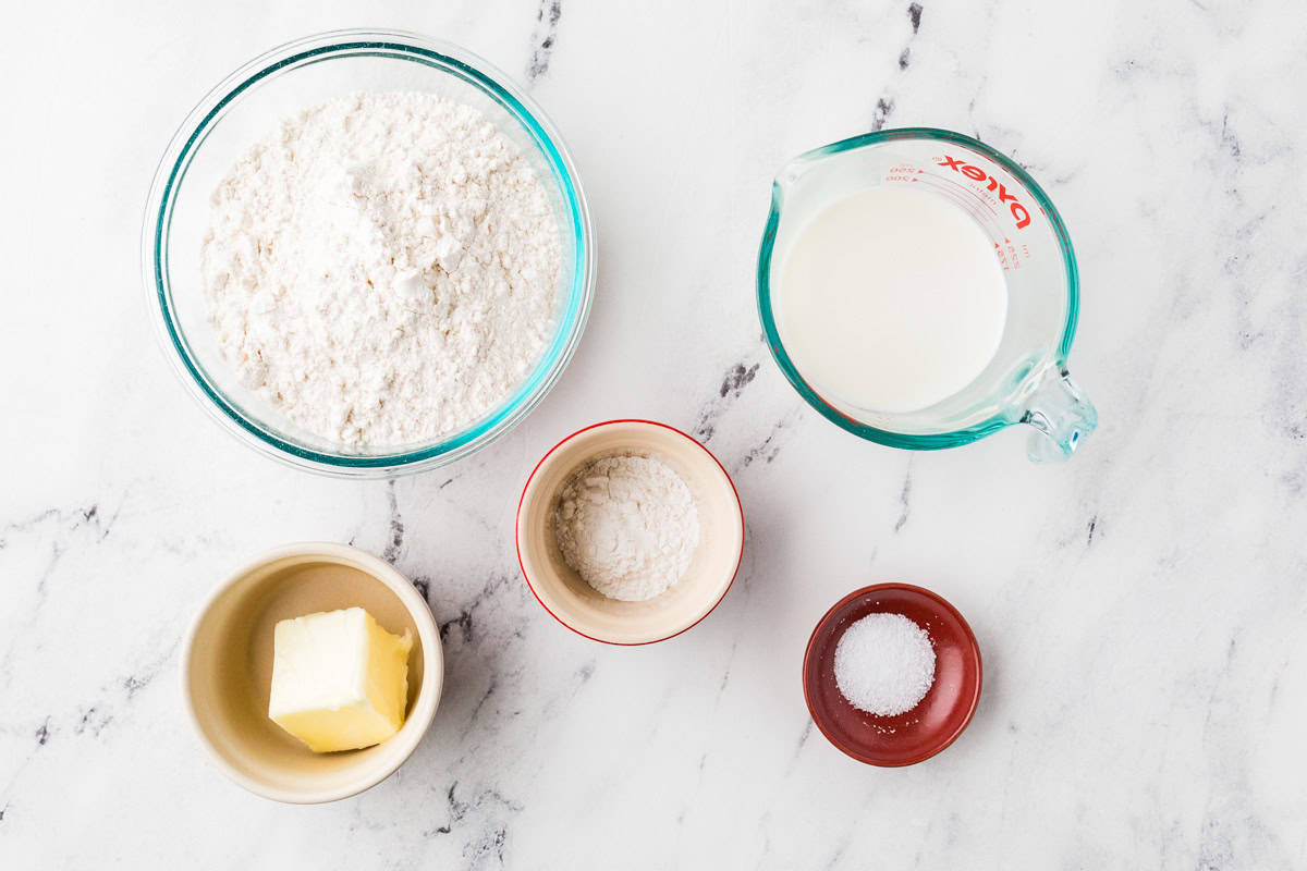 Ingredients for pizza dough on a counter.