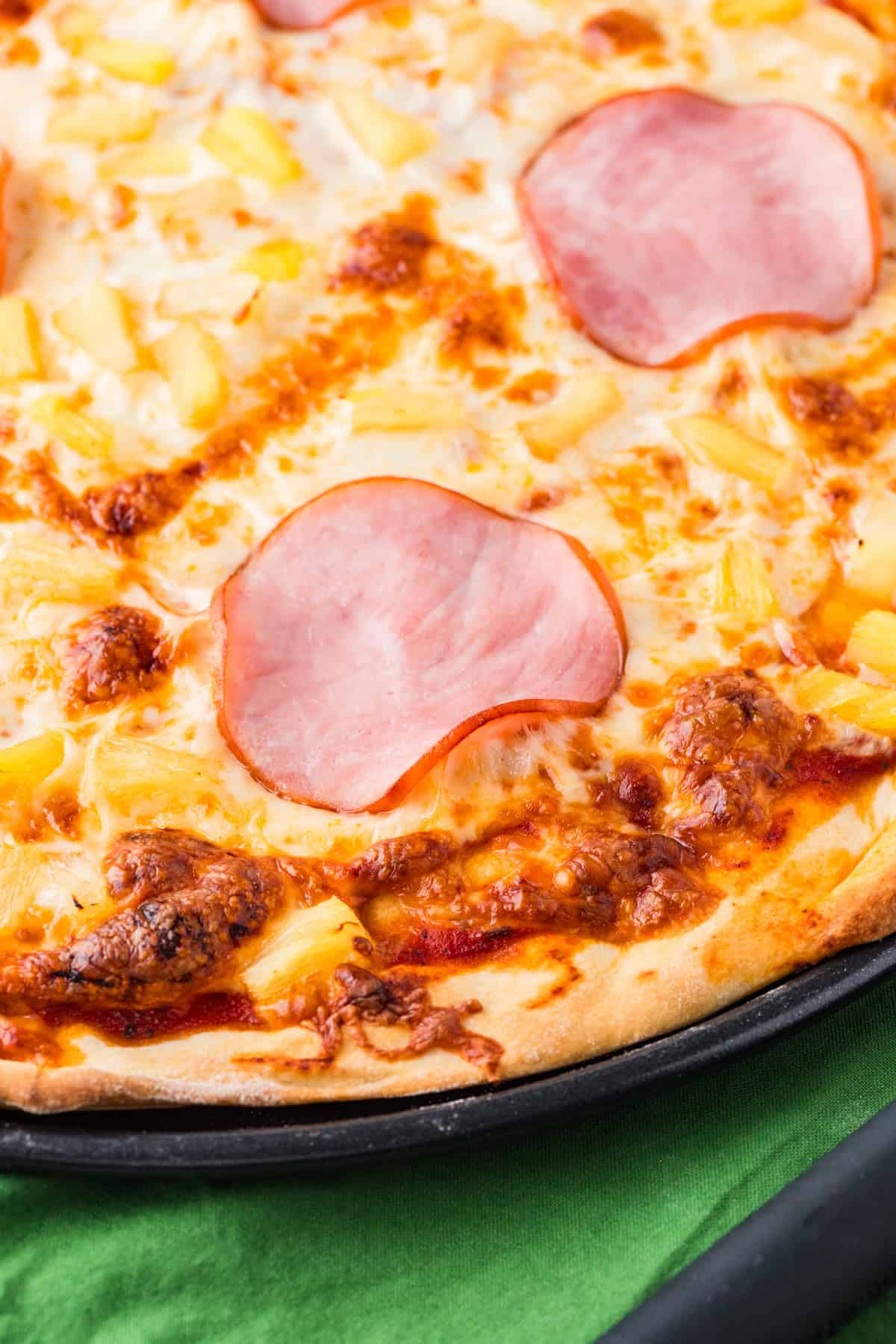 Edge of a canadian bacon pineapple.