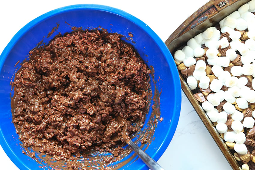 chocolatey rice krispies in a bowl next to a pan of brownies