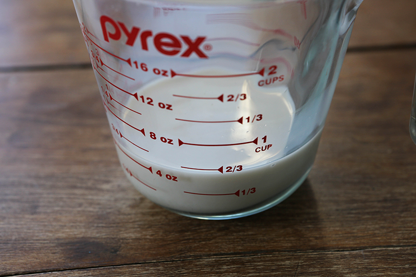 milk in a liquid measuring cup