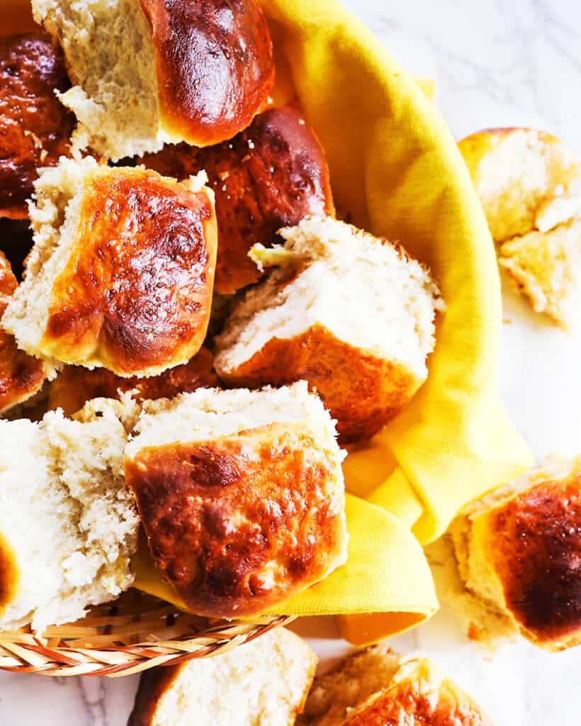 bread basket filled with fluffy dinner rolls