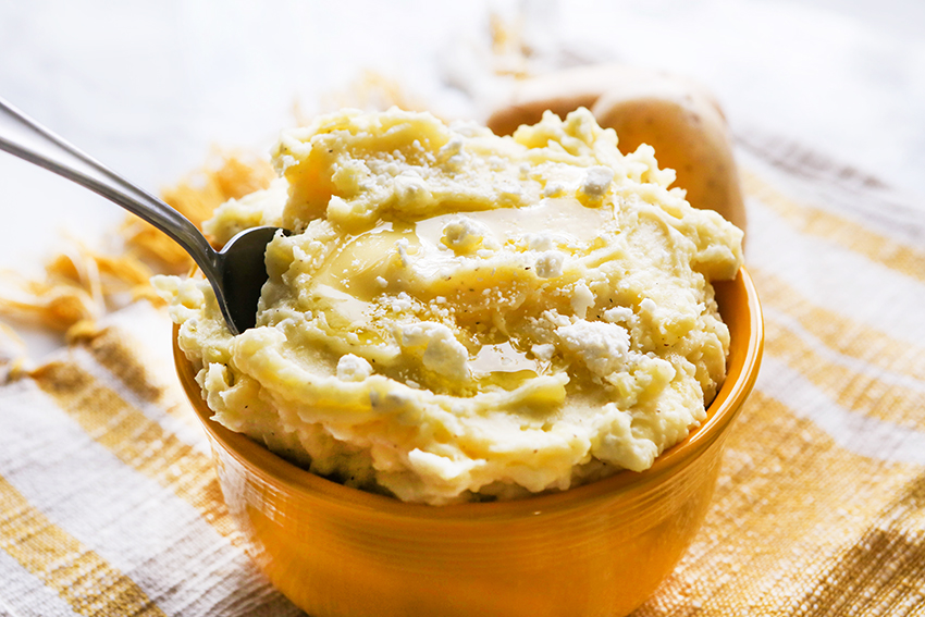 a bowl of feta mashed potatoes 