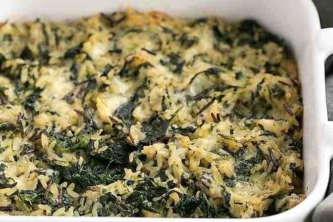 casserole dish with prepared cheesy spinach rice casserole