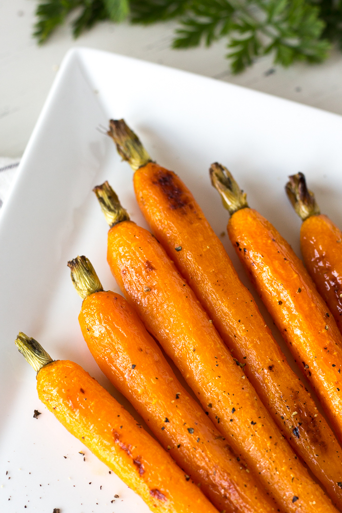 roasted carrots with honey butter glaze on a serving plate