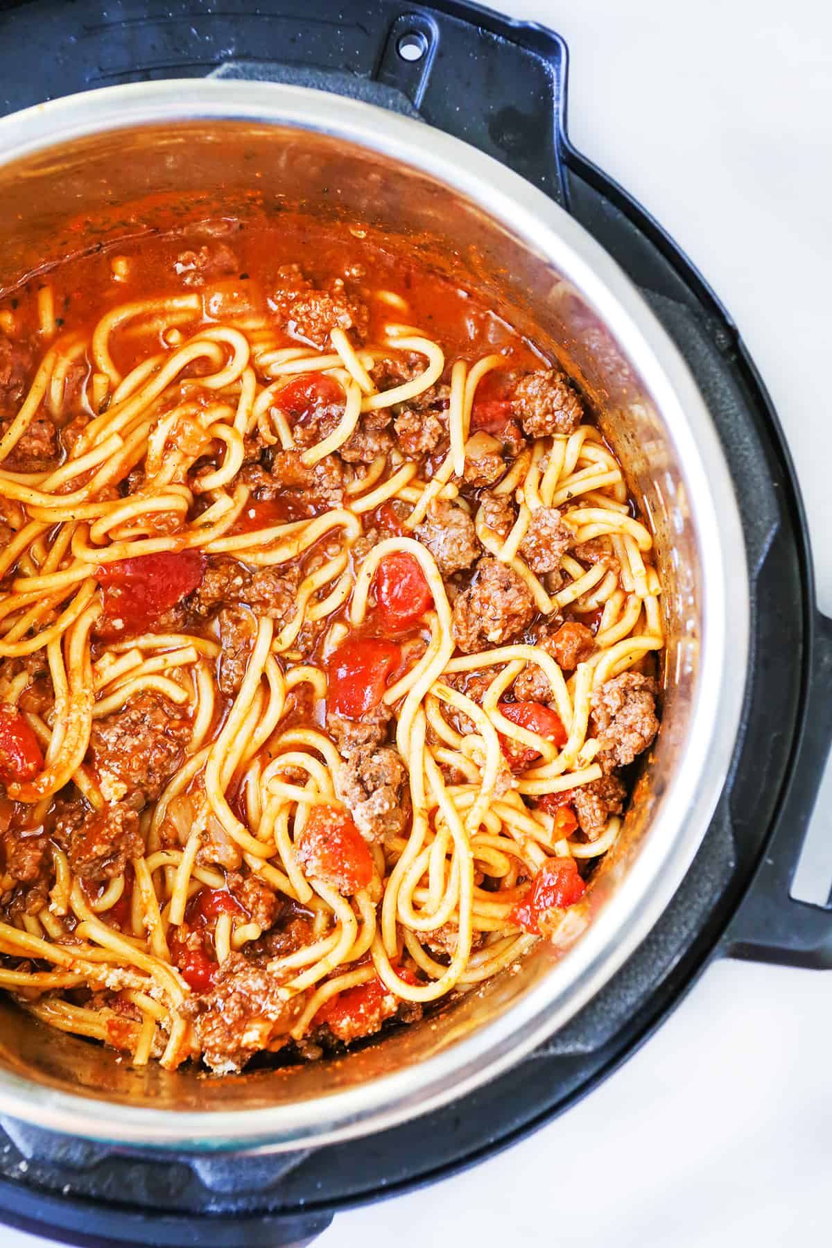 Top view of Instant Pot full of cooked spaghetti 