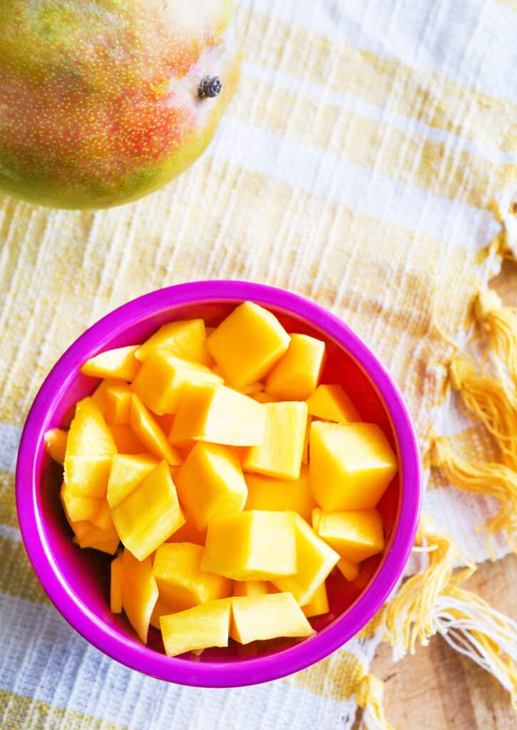 top view of a bowl full of mango bites