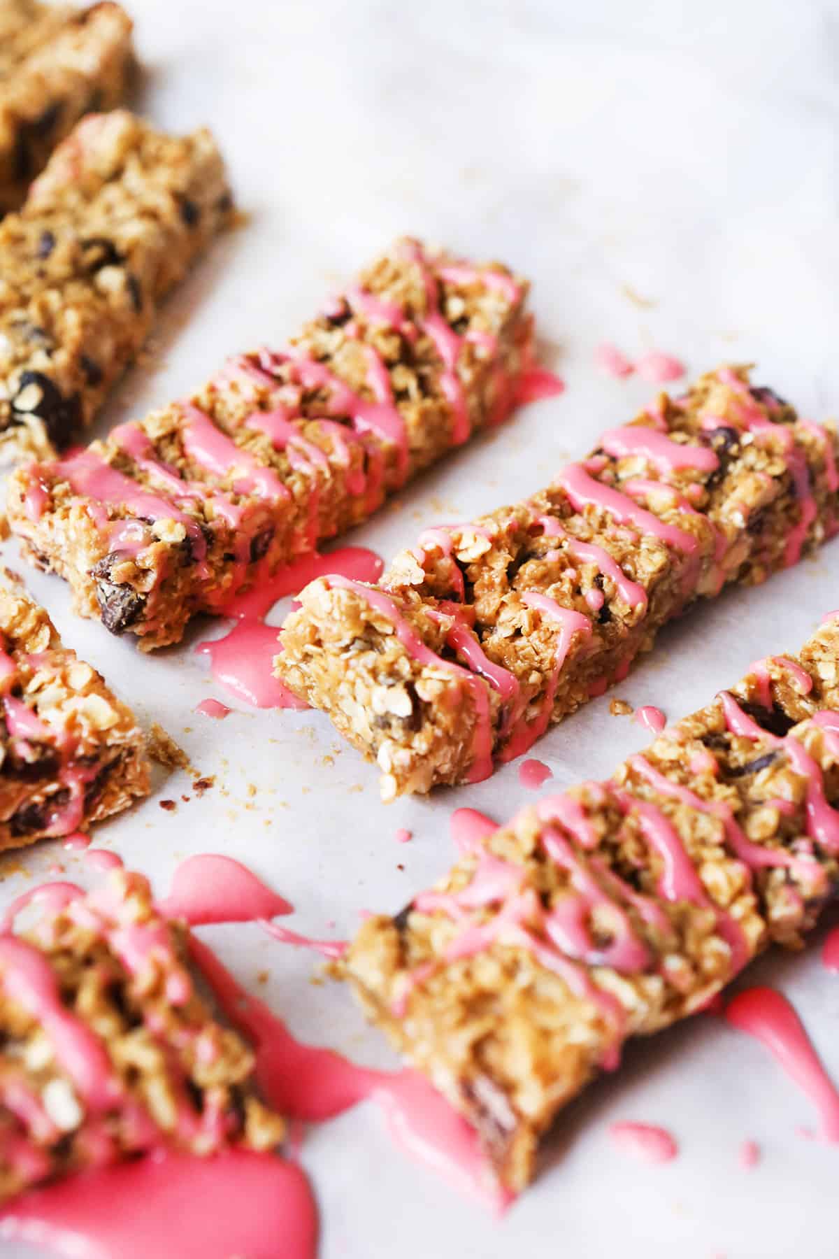 granola bars cut into strips and drizzled with pink icing